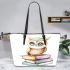 Cute owl sitting on top of books leather tote bag