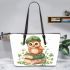 Cute owl wearing a green beret sitting on books leather tote bag