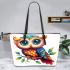 Cute owl with big eyes colorful feathers and beautiful wings perched leather tote bag