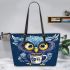 Cute owl with big yellow eyes holding a coffee cup leather tote bag