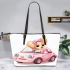 Cute pink car with a cute puppy inside leather tote bag