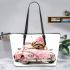 Cute pink car with a cute puppy wearing a bow on its head leather tote bag
