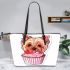 Cute pink yorkshire terrier in a cupcake leather tote bag