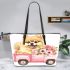 Cute pomeranian dog in a pink truck with flowers leather tote bag