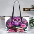 Cute purple owl sitting on top of books surrounded leather tote bag