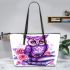 Cute purple owl sitting on top of books surrounded by pink roses leather tote bag