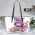 Cute purple owl sitting on top of books surrounded by pink roses leather tote bag