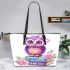 Cute purple owl sitting on top of books with pink roses leather tote bag