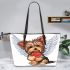 Cute valentine yorkie with angel wings holding heart leather tote bag