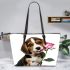 Cute valentine's day beagle puppy holding a pink rose leather tote bag