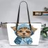 Cute yorkshire terrier in hoodie leather tote bag