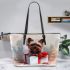 Cute yorkshire terrier inside a large gift box leather tote bag