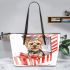 Cute yorkshire terrier inside an open present box leather tote bag