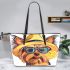 Cute yorkshire terrier wearing summer leather tote bag