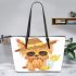 Cute yorkshire terrier wearing summer leather tote bag