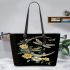 Dragonflies and three flowers on the moon leather tote bag