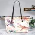 Dragonflies with delicate lace patterns featuring leather tote bag