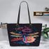Dragonfly surrounded by flowers leather tote bag