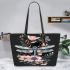 Dragonfly with flowers in pastel colors leather tote bag