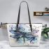 Dragonfly with swirling lines and swirls leather tote bag