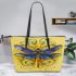 Dragonfly with swirls and filigree leather tote bag