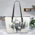 Ethereal deer with large antlers standing in the middle leather totee bag