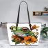 Frog with lily flower on its back leaather tote bag