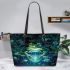 Glowing green frog sits on the water's surface leaather tote bag