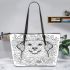 Golden retriever surrounded by flowers coloring leather tote bag
