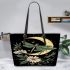 Green dragonflies flying around the moon leather tote bag