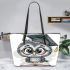 Grey owl with big eyes wearing glasses and graduation hat holding leather tote bag