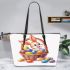 Happy easter bunny with colorful eggs in a basket isolated leather tote bag