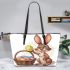 Happy easter bunny with colorful eggs in a basket isolated leather tote bag