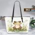 Happy frog sitting in the grass near a pond leaather tote bag