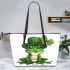 Ominous frog with clover in his hat leaather tote bag