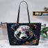 Panda with black and white fur and colorful floral leather tote bag