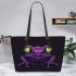 Purple frog with bright green eyes and on a solid leaather tote bag