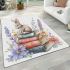 Rabbit sitting on top of books surrounded by flowers area rugs carpet
