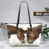 Realistic drawing of an adult horse and foal leather tote bag