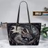 Sad dragon with dream catcher leather tote bag