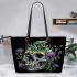 Skull with green frog on top and purple thistle flowers growing leaather tote bag