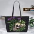 Skull with green frog on top and purple thistle flowers growing leaather tote bag