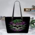 Skull with green frog on top and purple thistles growing leaather tote bag