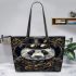 Steampunk panda with top hat and monocle holding golden gears leather tote bag