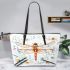 The Dragonfly with violins and music notes in summer Leather Tote Bag
