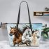 Three horses galloping in the wind leather tote bag