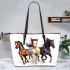 Three horses galloping in the wind leather tote bag