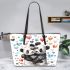 Two cute pandas hugging surrounded colorful hearts leather tote bag