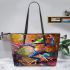 Vibrant painting of an happy dancing frog leaather tote bag