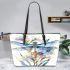 Watercolor dragonfly among flowers leather tote bag